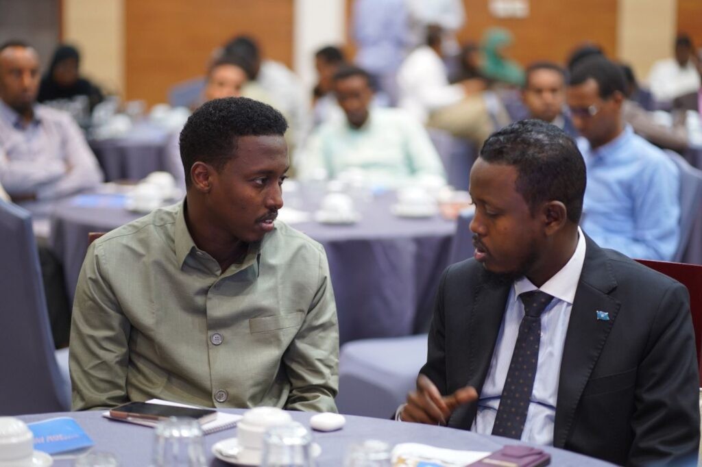 The launch stage in Mogadishu, designed around the portal's own interface rather than a generic institutional backdrop.